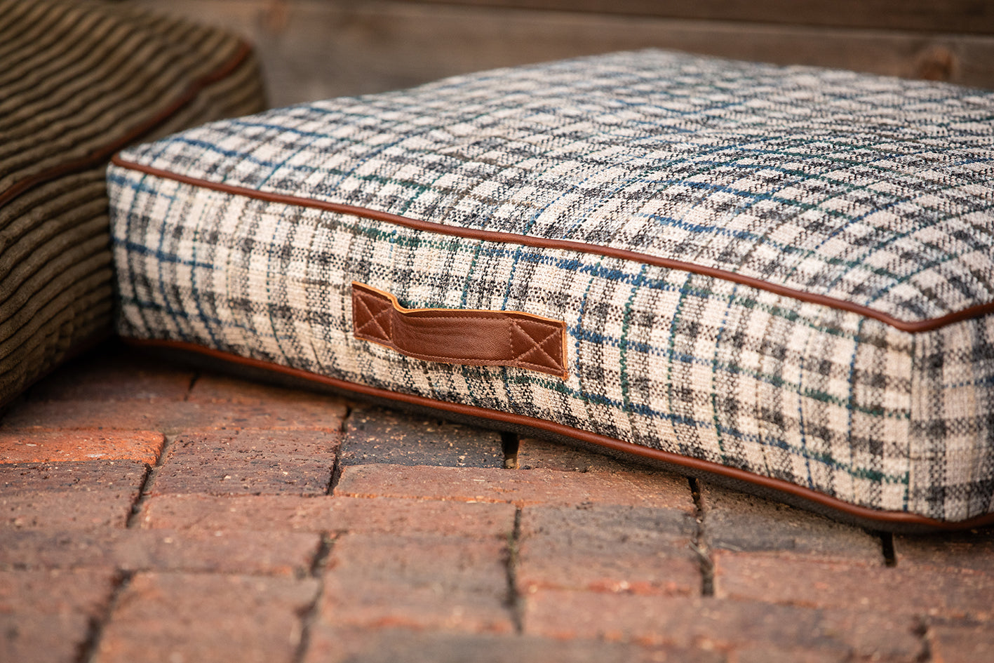 Dog bed in grey & blue tartan with leather piping